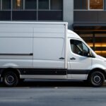 A photograph of a medium-sized used van with an isotermic box